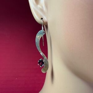 Sterling Silver Wavy Dangle Earrings with a Garnet Stone. 2.25 inches long